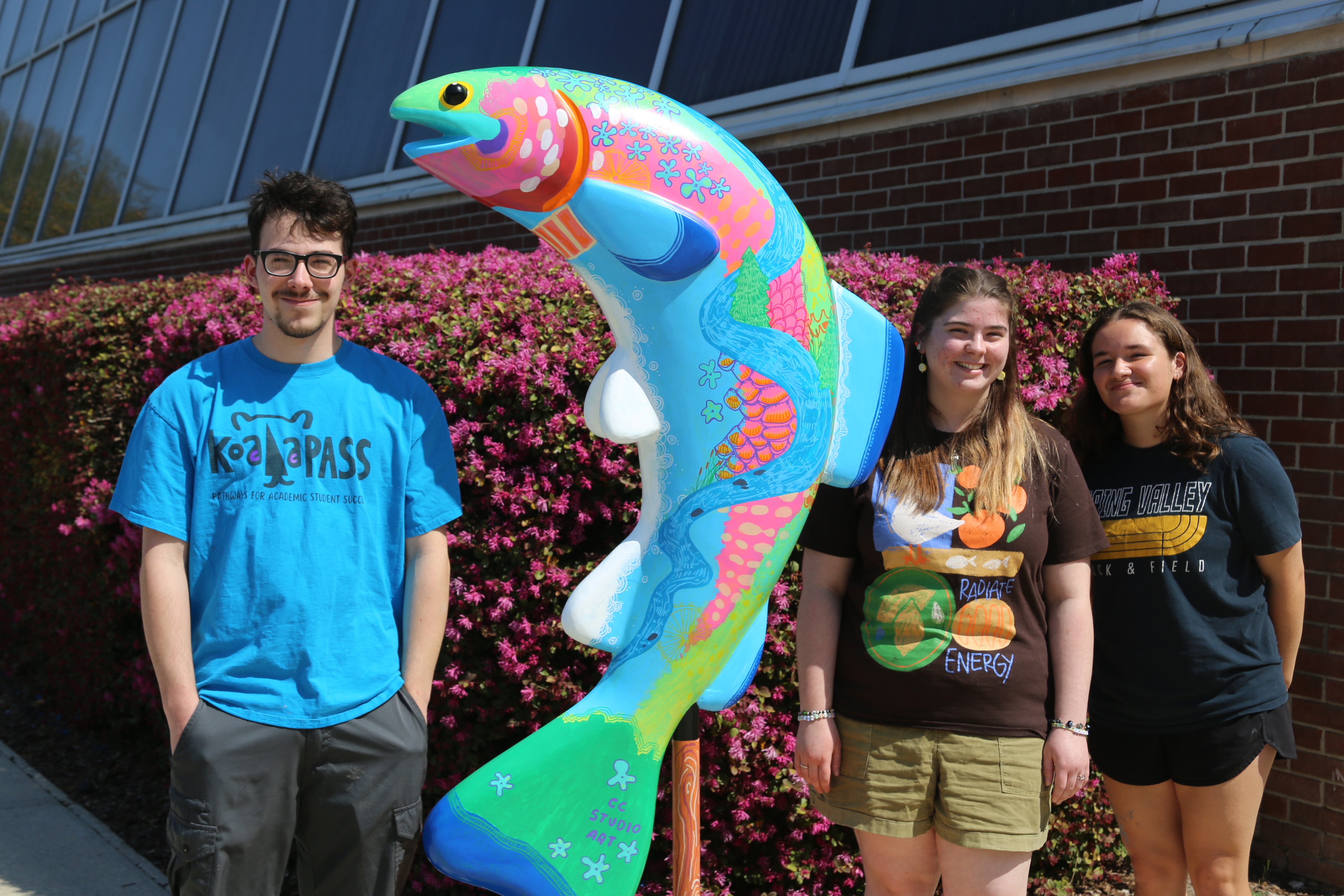 trout sculpture and students