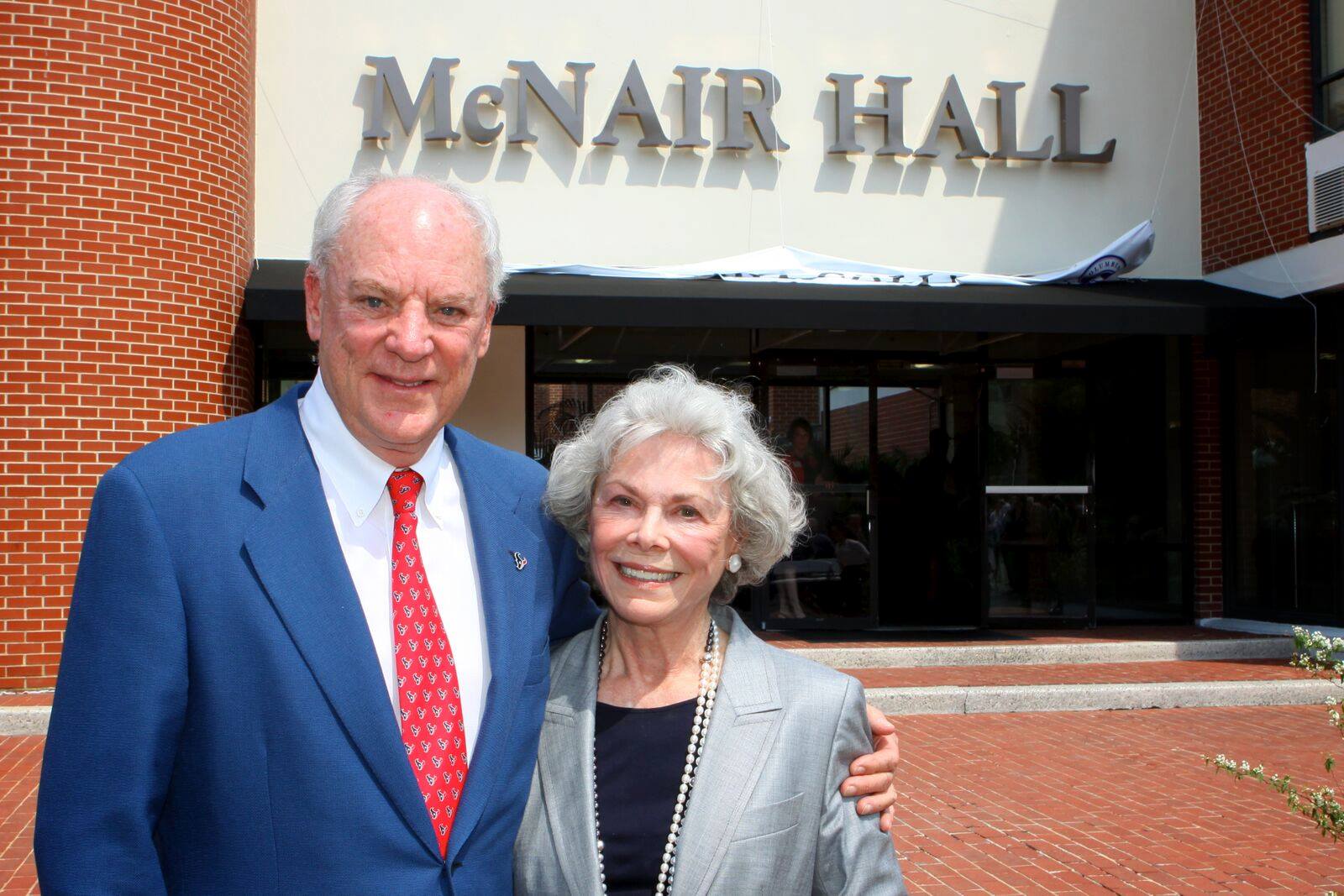 Bob McNair in front McNair building