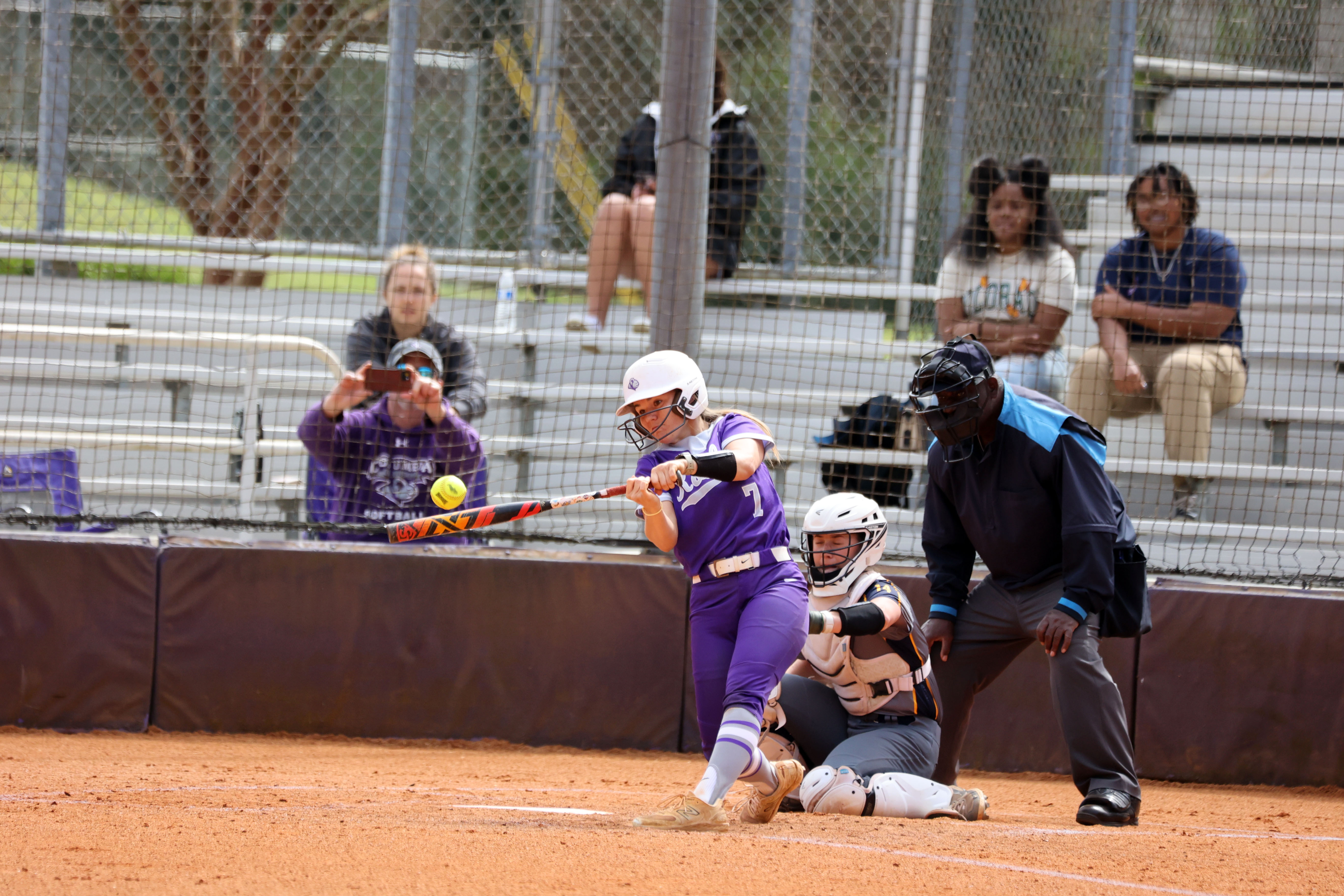 softball player batting