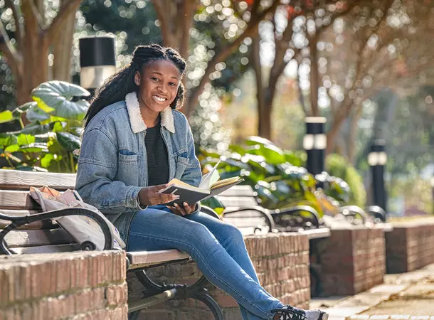 girl sitting on campus