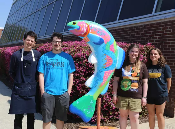 martin lang, students, and trout sculpture